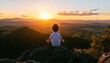 © Outkast - Child meditates at sunset, mountaintop view