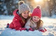 © Sergey - Caucasian female children playing in snow with winter hats and coats on a sunny winter day