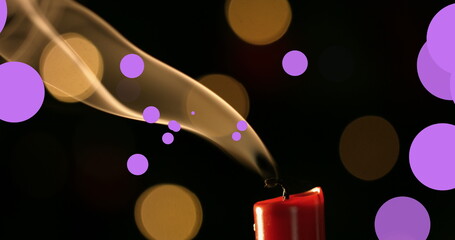 Poster - Image of violet and yellow dots over fading out candle on black background