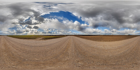 Wall Mural - hdri 360 panorama on gravel road among farming fields with tire tracks in equirectangular full seaml