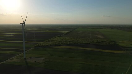 Aufkleber - Wind turbine on an agricultural filed at sunset	