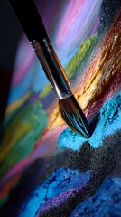 Poster - Colorful paint brush resting on vibrant canvas of a passionate artist's masterpiece
