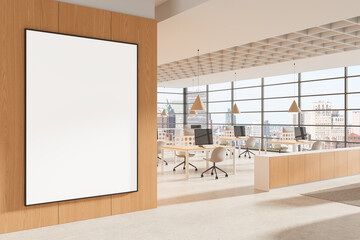 Poster - Blank vertical poster mockup inside modern open office interior with large windows, light wood wall, and clean workspace design layout. 3D Rendering