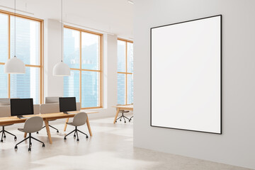 Poster - modern office with large blank poster on white wall and city view through windows in bright interior