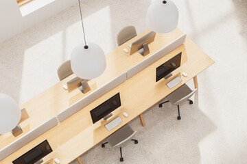 Poster - top view of modern office interior design with shared wooden desks, minimalist chairs, and pendant l