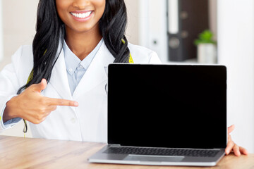 Aufkleber - Positive female nutrition specialist pointing at laptop with blank screen at medical office, mockup for your website. Professional black dietitian promoting weight loss clinic, space for design