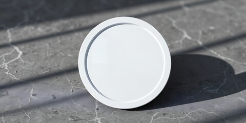 Poster - A white round object sits on a gray textured surface with shadows cast across the background