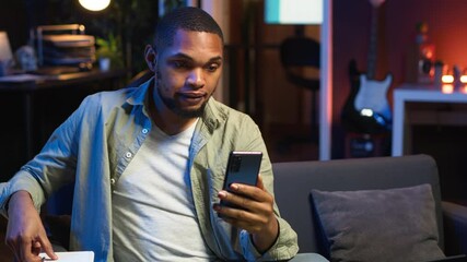 Poster - african american teleworker calling coworker on video conference to take notes, writing new ideas an