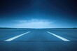© Syifa - Empty tarmac runway at dusk.  Vast, dark blue sky with soft clouds.  White lines mark the center