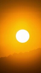 Wall Mural - dramatic sunset time lapse over a cloudy mountain ridge.