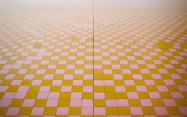 Poster - photograph of an infinite, seamless checkerboard pattern featuring alternating squares of sunny yellow and soft rose pink. The squares are perfectly symmetrical