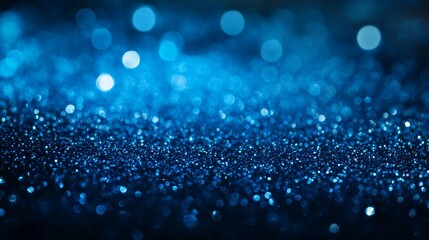 Poster - Vibrant Blue Glitter Sparkling Under Soft Light Creates a Mesmerizing Display of Color and Texture, Perfect for Artistic Projects and Decorative Purposes in a Dark Setting