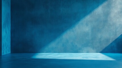 Poster - Quiet Interior Space With Textured Blue Wall and Soft Shadows Creating a Calming Atmosphere in the Early Morning Light