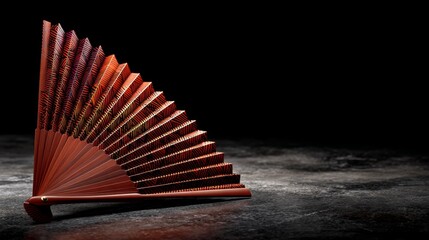 Poster - A beautifully detailed folding fan made of lacquered wood and patterned silk rests slightly open on a dark reflective surface, offering space for text or design