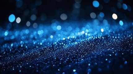 Poster - Vibrant Blue Glitter Sparkling Under Soft Light Creates a Mesmerizing Display of Color and Texture, Perfect for Artistic Projects and Decorative Purposes in a Dark Setting