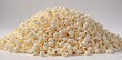 © intothestar - A fluffy mound of popcorn against a pure white backdrop , buttery, macro
