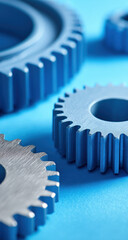 Aufkleber - Closeup view of metallic blue gears intermeshing on a vibrant blue background showcasing intricate details and mechanical precision. : Generative AI