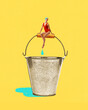 © master1305 - Woman in red swimsuit sits on metal bucket handle with drop falling below against yellow background. Contemporary art collage. Concept of summer, vacation, surrealism, creative design