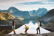 © EVERST - Norway family travel lifestyle active tour parents and child hiking in Lofoten Islands exploring mountains together summer vacations trip, mother father and kid on adventure camping tour at the lake