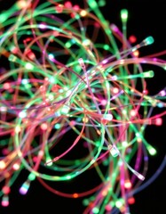 Fototapete - a vibrant and dynamic composition showcasing a bunch of green and red fibre optics intertwining and glowing against a dark background