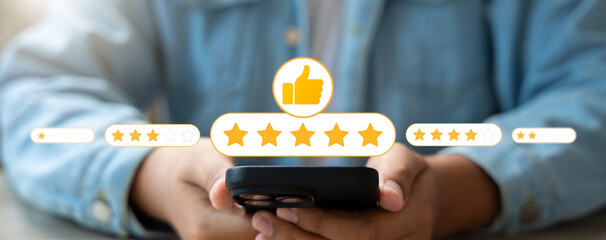 Canvas Print - Customer using smartphone to provide five star product review with thumb up icon.Online feedback and satisfaction survey reflect service quality,Building trust,Improving digital brand reputation