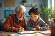 © PremiumPhoto - Elderly man. Elderly man and boy drawing colorful pictures together at
