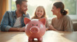 © K1drock - Glossy pink piggy bank on wooden table in foreground with smiling family discussing finances in background