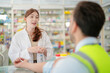© ultramansk - pharmacist engages with a customer offering guidance on medication usage. emphasizes the critical role of pharmacists in ensuring patient engineer worker safety and delivering personalized healthcare.