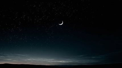 Wall Mural - Night sky with crescent moon and stars over a dark landscape.
