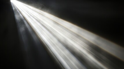Poster - Bright beam of light shining down through darkness abstract concept studio shot from above mysterious