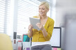 © peopleimages.com - Office, business woman and digital tablet for project research, online website and working with smile. Female receptionist, reading and planning for human resource, administration and tasks with tech