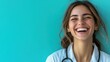 © Леся Озарчук - Laughing young caucasian female doctor with stethoscope against blue background