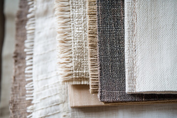 Poster - Variety of natural and engineered textile materials stacked together Generative AI