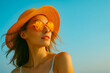 © Fleuronica - Young woman enjoying a sunny day at the beach wearing a stylish hat and sunglasses with dollars, sale season