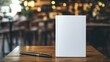 © Honey - Blank white book mockup on wooden table in cafe setting pen work blur life cover space brown clean