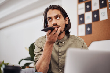 Poster - Indian man, remote work and speaker phone with laptop in home, business conversation for startup. Male entrepreneur, mobile communication or website development in house, thinking or digital planning