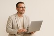 © Rawpixel.com - Smiling man using laptop.