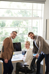 Poster - Portrait, people and smile on computer in office for research, planning and ideas as web designer with manager. Woman, men and pc for teamwork, brainstorming and feedback review of project update