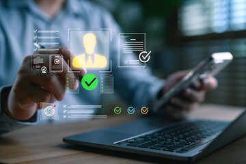 Leinwandbilder - A businessman using smart technology to verify digital identity, KYC documents, and approve online profiles, representing secure authentication and onboarding in digital business platforms.