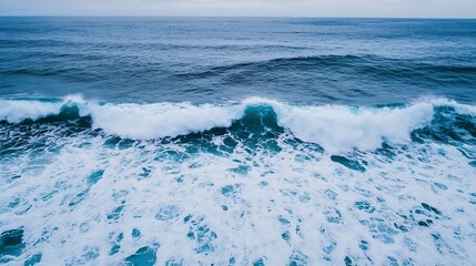 Leinwandbilder - Aerial view of powerful ocean waves crashing, creating white foam and turquoise water. Dramatic seascape with deep blue water and textured wave crests. : Generative AI