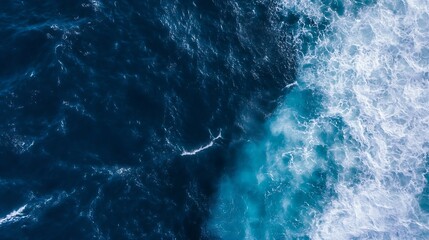 Leinwandbilder - Aerial view of ocean waves, deep blue water contrasting with white foam, showing a dynamic ocean surface texture. Perfect for backgrounds or marine-themed designs. : Generative AI
