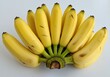 © stock.metket.com - Bunch of fresh yellow bananas clustered together on a white surface in a close-up shot