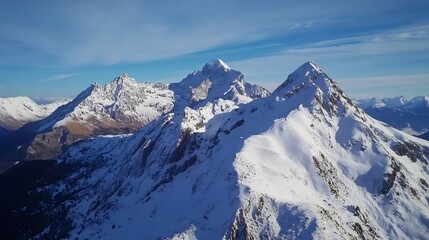 Poster - Aerial view of majestic snow-capped alpine mountains under a vibrant blue sky, showcasing rugged peaks and pristine winter landscape. : Generative AI