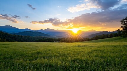 Poster - Majestic sunset over rolling green hills and mountains, casting long shadows and golden light across a vast meadow landscape. : Generative AI