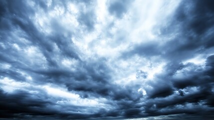 Poster - Dramatic, dark blue storm clouds fill the sky, creating a moody and intense atmosphere.  Heavy, textured cloudscape perfect for weather, nature, or ominous backgrounds. : Generative AI