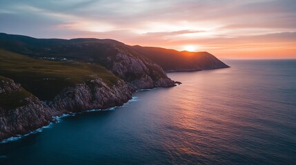 Poster - Stunning sunset over dramatic coastal cliffs and ocean, vibrant orange and purple hues paint the sky and water, creating a breathtaking landscape. : Generative AI