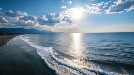 Poster - Aerial view of a serene coastal scene, showcasing gentle waves lapping a sandy beach under a bright, sun-drenched sky with fluffy cumulus clouds and distant mountains. : Generative AI