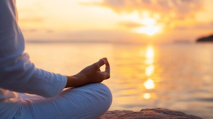 Poster - Woman meditates in lotus position on a rock by the sea at sunset, enjoying peace and tranquility. Golden hour light illuminates the scene, creating a serene and calming atmosphere. : Generative AI