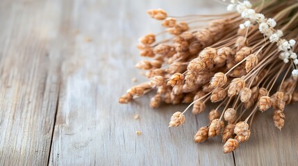 Poster - Dried wheat stalks and small white flowers arranged on a rustic wooden surface, creating a minimalist autumnal still life. : Generative AI