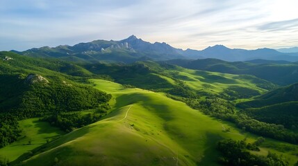 Aufkleber - Aerial view of rolling green hills and majestic mountains under a bright, clear sky. Lush vegetation covers the landscape, creating a serene and picturesque scene. : Generative AI